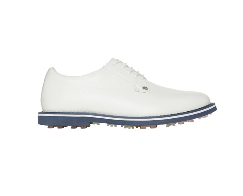 Classic white leather lace-up golf shoe featuring a navy blue midsole stripe and a spikeless rubber nubbly outsole.