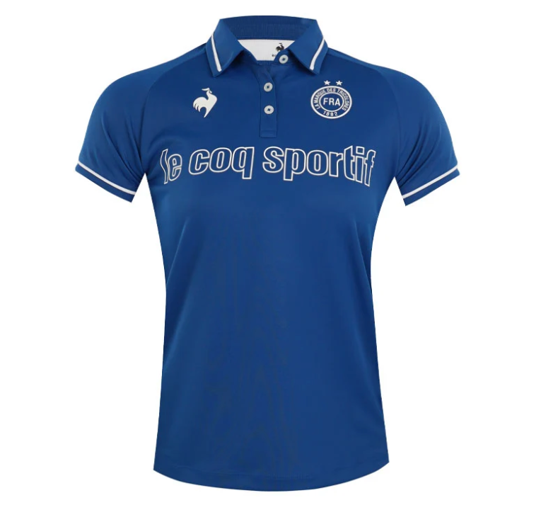  Le Coq Sportif women's royal blue short-sleeve polo shirt featuring white script chest branding, embroidered rooster logo, FRA badge, and tipped collar details.