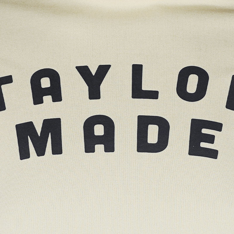 TAYLORMADE Logo Graphic Women?s Mock Shirt (Cream)